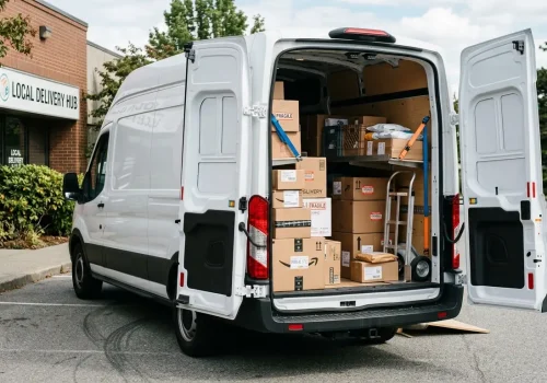 White_cargo_van_open_doors_202606141526